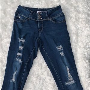 Distressed blue jeans mid rise